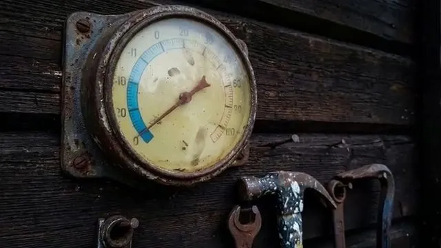 Close-up of a temperature gauge on a frozen line
