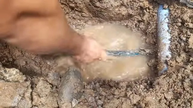 Muddy ground around a burst water line