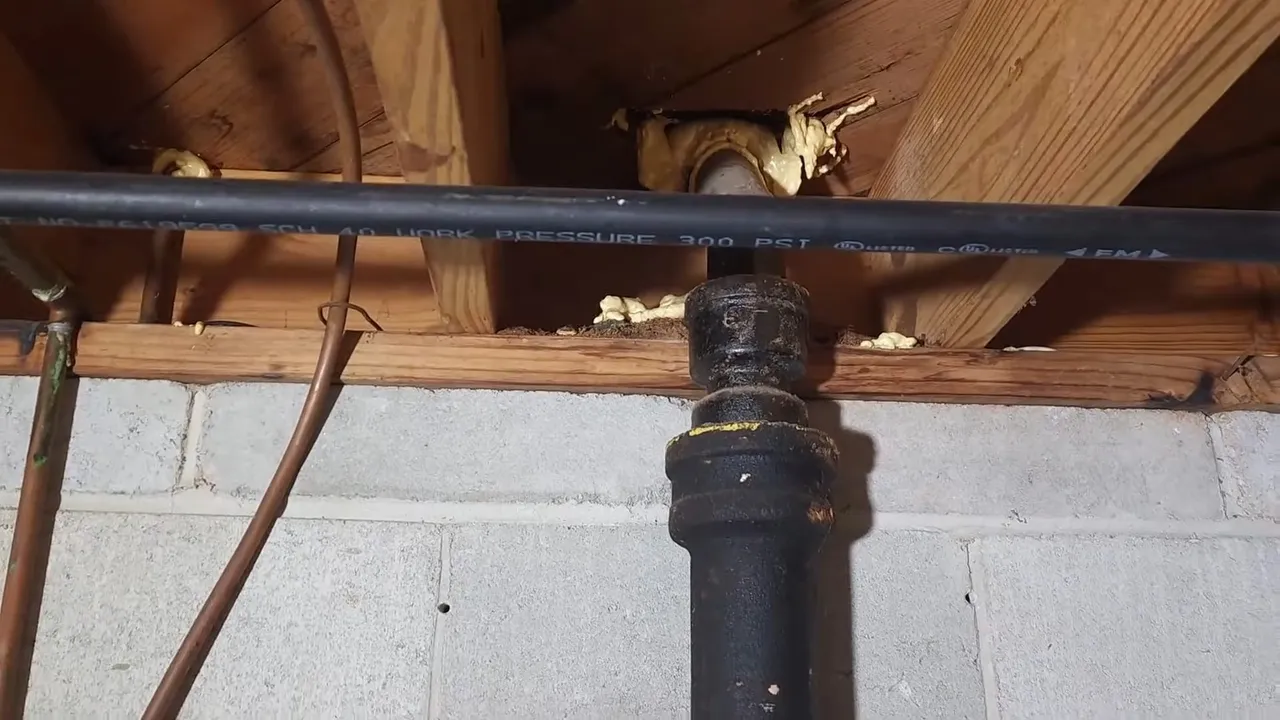 Old cast-iron sewer pipe replaced with PVC