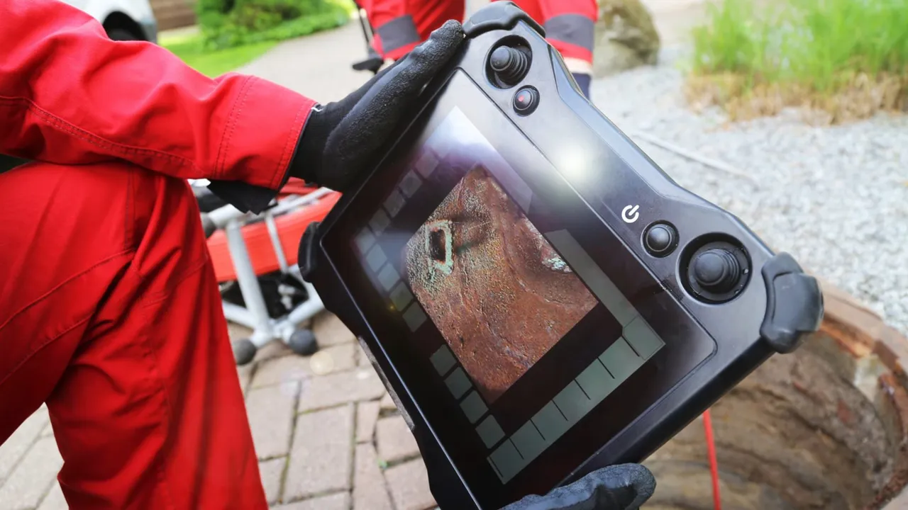 Pipe camera inspecting a sewer line