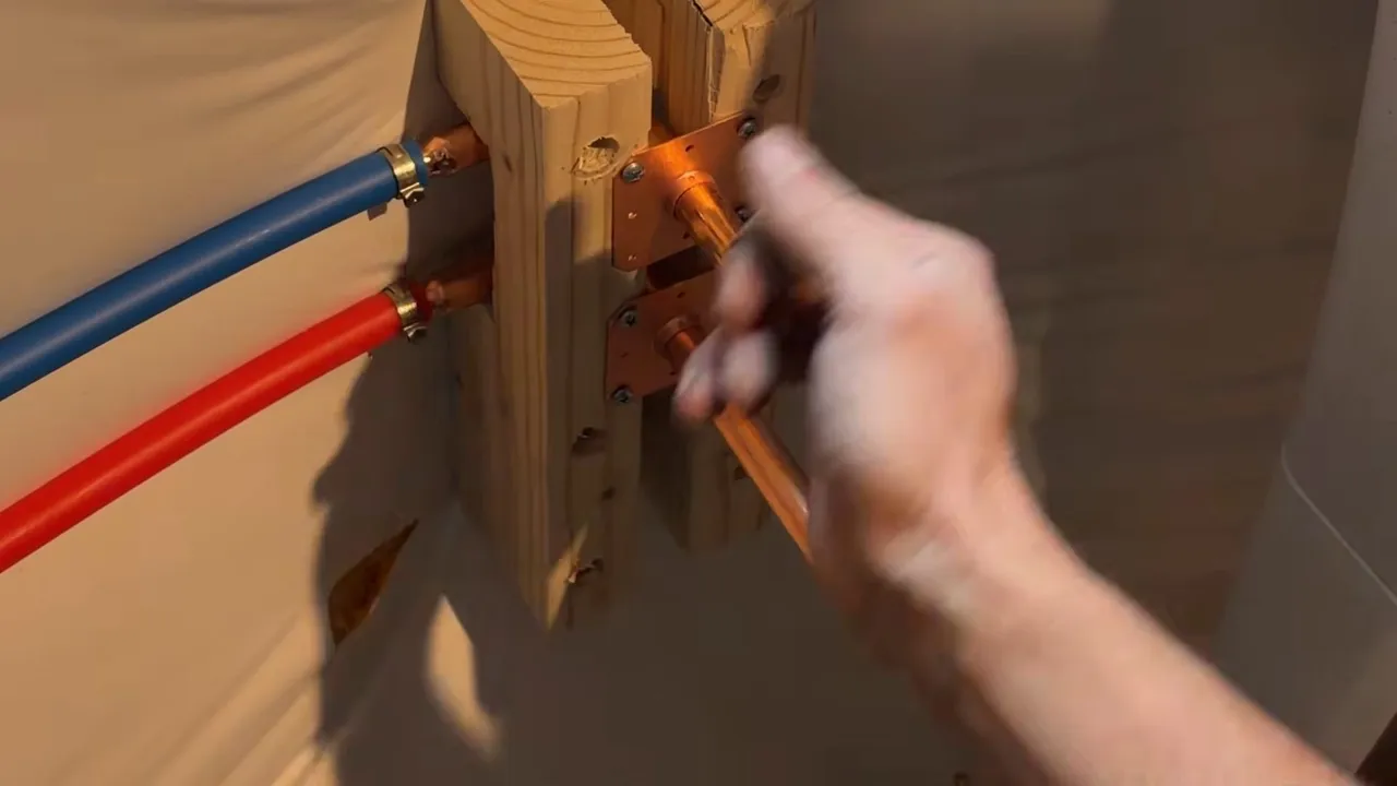 Plumber measuring a basement utility sink pipe