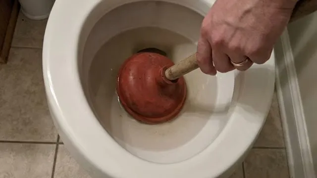 Scrubbing debris from a floor drain