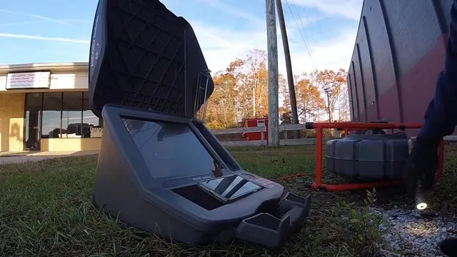 Sewer camera control station set up outside a building