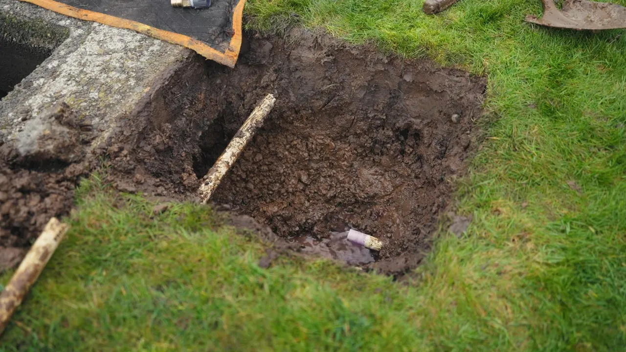 Shovel beside an open service line trench
