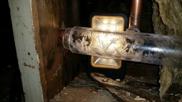 Warming a frozen pipe with a hair dryer