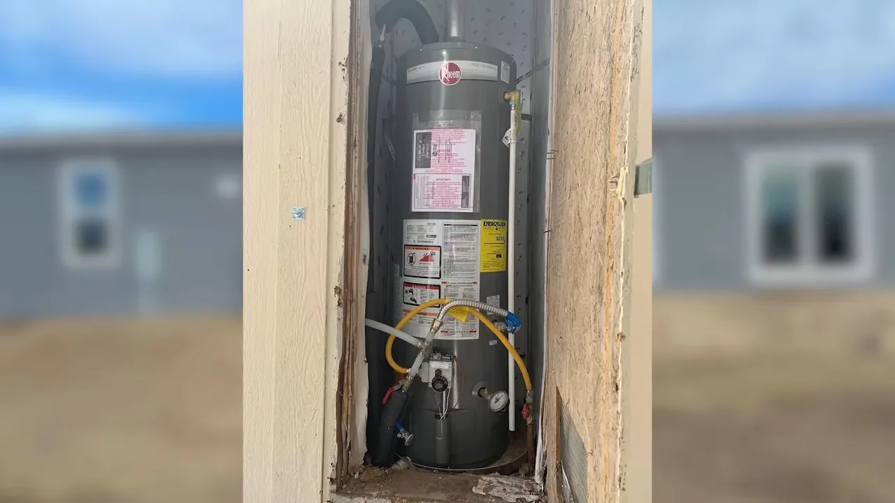 Water heater visible through a wall opening