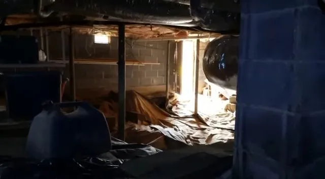 Wide view of plumbing in a home crawlspace
